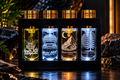 Komorebi Discovery Collection with four engraved 10 ml fragrances illuminated in a black display stand