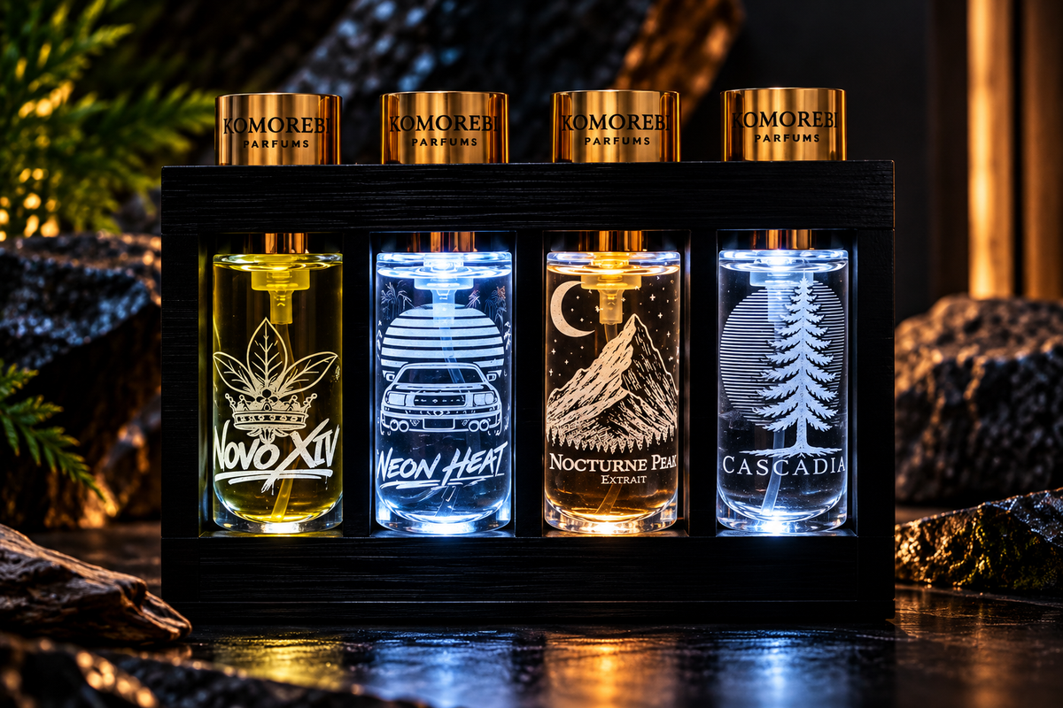 Komorebi Discovery Collection with four engraved 10 ml fragrances illuminated in a black display stand